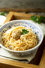 Spaghetti with meatballs, cheese and tomato sauce