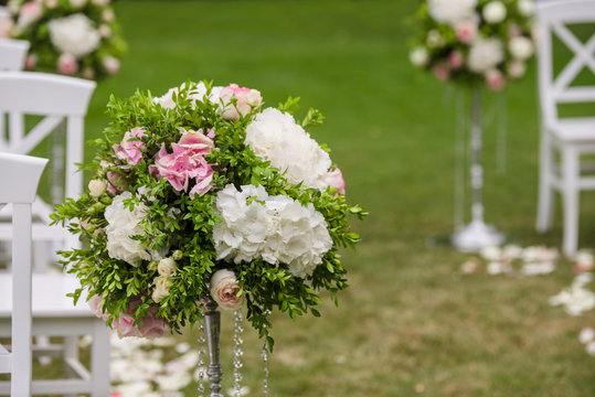 flowers in vases on wedding ceremony