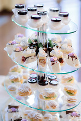 Pieces of tasty cakes served on layered dish