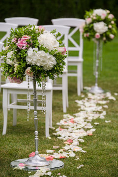 flowers in vases on wedding ceremony