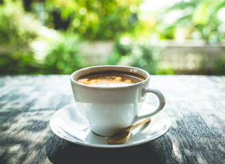 Capuccino, mocha, latte,americano, espresso hot coffee aroma in cup breakfast morning drink on wooden table vintage bar windows in cafe shop with newspaper restaurant background,copy space the left.