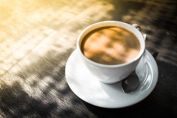 Capuccino, mocha, latte,americano, espresso hot coffee aroma in cup breakfast morning drink on wooden table vintage bar windows in cafe shop with newspaper restaurant background,copy space the left.