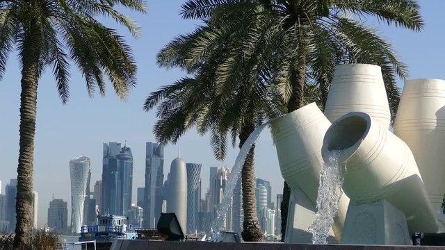 Fountain located along the Dhow Harbour with the Doha skyline in the background in Qatar