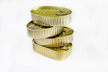 Various cans of canned unopened fish on white background.