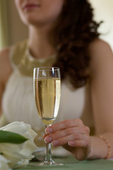 a glass of champagne on the table the newlyweds close-up on clearance