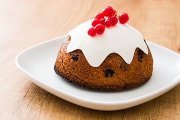 Christmas pudding on wooden table
