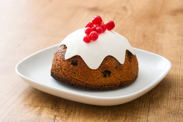 Christmas pudding on wooden table

