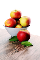 Ripe red apples on wooden background summer concept