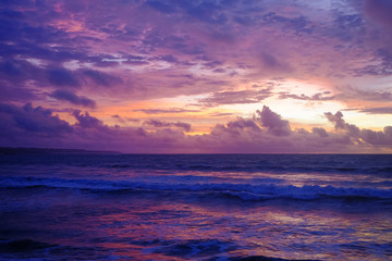 Fototapeta na wymiar Spectacular purple balinese sunset on the sea. Bali, Indonesia.