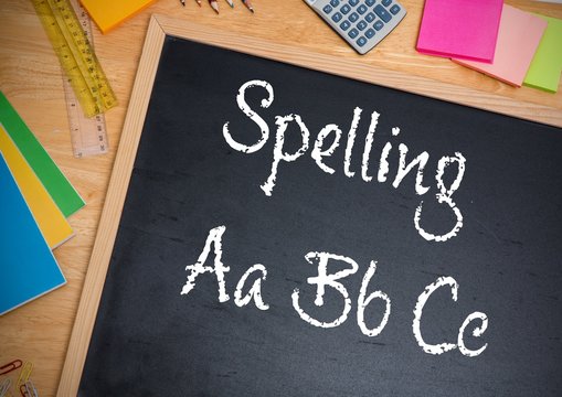 Hand writing Spelling text on blackboard
