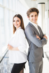 Confident business team of man and woman standing with crossed hands. couple of success business people ready to act.