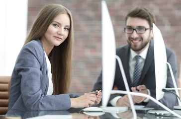 employees discuss work issues in the office