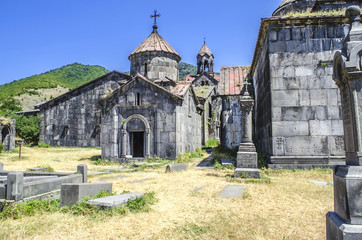 Naklejka premium Church of the Blessed Virgin and a view of the three-nave bell tower on the territory of the monastery of Haghpat 