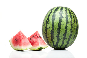 watermelon with slices standing isolated on white background