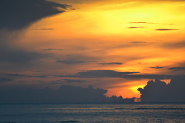 The sun began to rise from the sea in the morning.