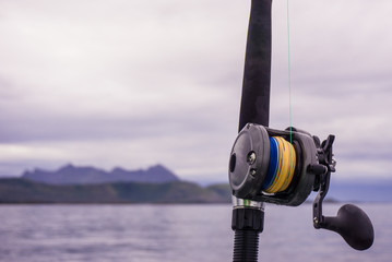 Fishing spinning and reel in the summer sea, Norway.