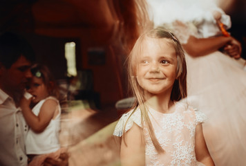 Smiling little girl with long hair