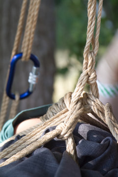 Shibari in nature in summer. Bound young girl.