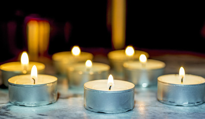 Tea candle, burning, solemn