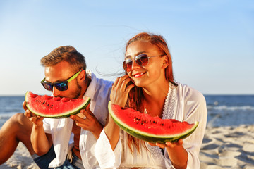 lovers on beach and water melon 