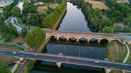 Fototapeta na wymiar Aerial top view of river, canal du Midi and bridges from above, Beziers town, South France 