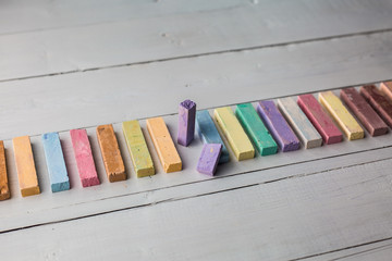 chalks on white wooden table