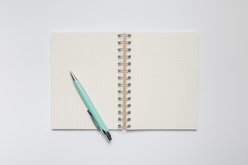 School notebook with stylish green pen