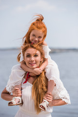 mother and daughter at seashore