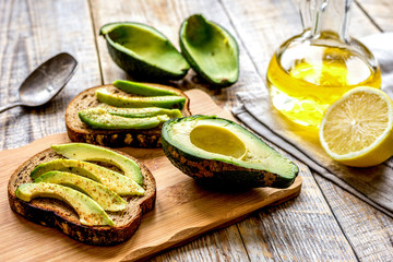 making sandwiches with avocado healthy organic food top view