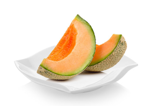 cantaloupe melon in ceramic plate on white background