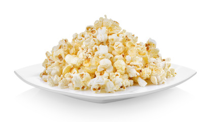 Popcorn in white plate on white background