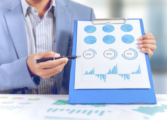 businessman present market share, graph, pie chart