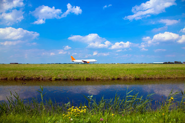 Plane takes off, sky, meadow and river