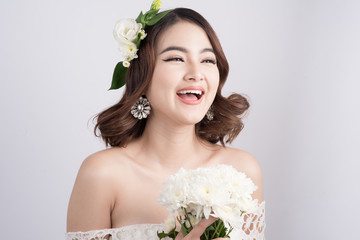 Beautiful asian woman bride on grey background. Closeup portraits with a professional makeup