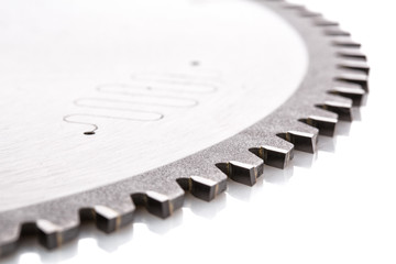 circular saws with teeth close-up, on a white - obrazy, fototapety, plakaty