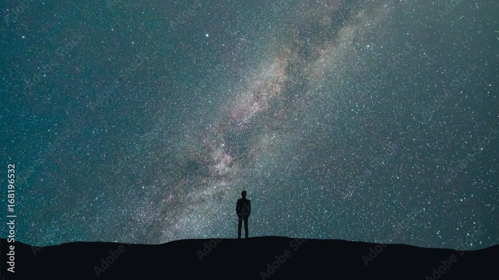 Sticker the man stand on a background of a milky way with asteroids skyfall. time lapse
