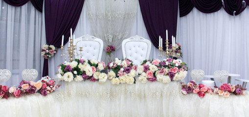 Beautiful flowers on table of brode and groom  on wedding day