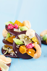 Obraz na płótnie Canvas Handmade chocolate with candied fruit and nuts