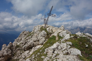 Fototapeta na wymiar Cross on Coldai Peak