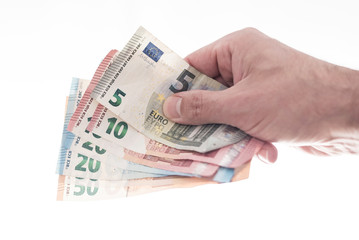 hand of male person handing over a couple of different euro bills
