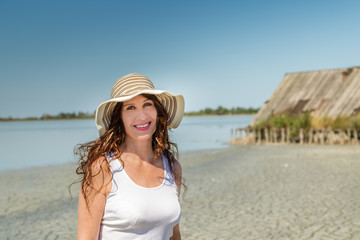 mature woman on sun split beach