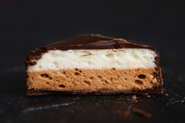 Cut candy bird's milk with  chocolate and vanilla souffle