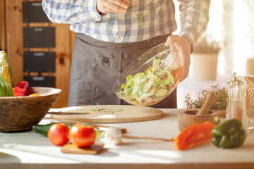 male cooking healthy salad