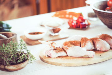 male preparing chicken for cooking