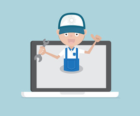 man holding wrench on laptop system maintenance concept