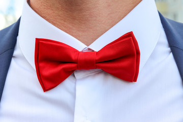 red bow tie on white shirt