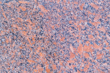 Pattern of red colorful granite, closeup. Background, textured.