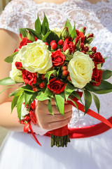 wedding bouquet in hand of bride