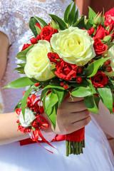 Bride holding in hand wedding bouquet