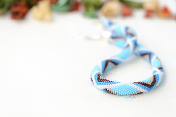 Blue bead crochet necklace with geometrical pattern